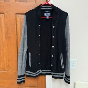 American Rag men’s varsity style sweater can be worn unisex